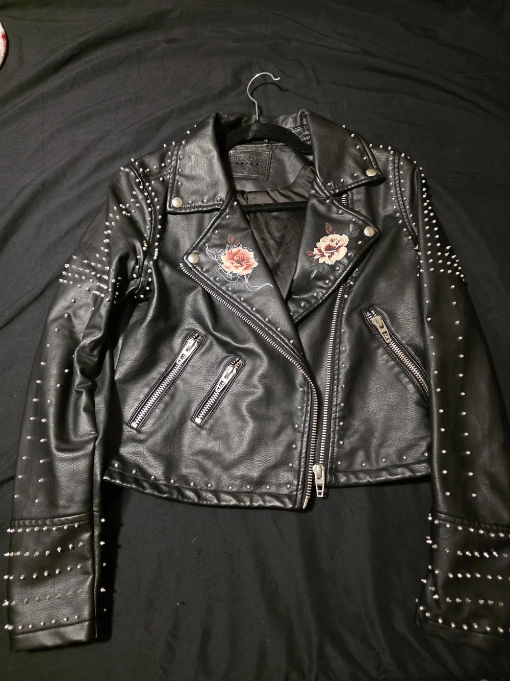 Blank NYC Black Studded Faux Leather Moto Jacket with Rose Details